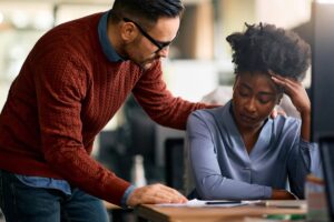 A coworker Providing Support After a Loss to an employee who is upset