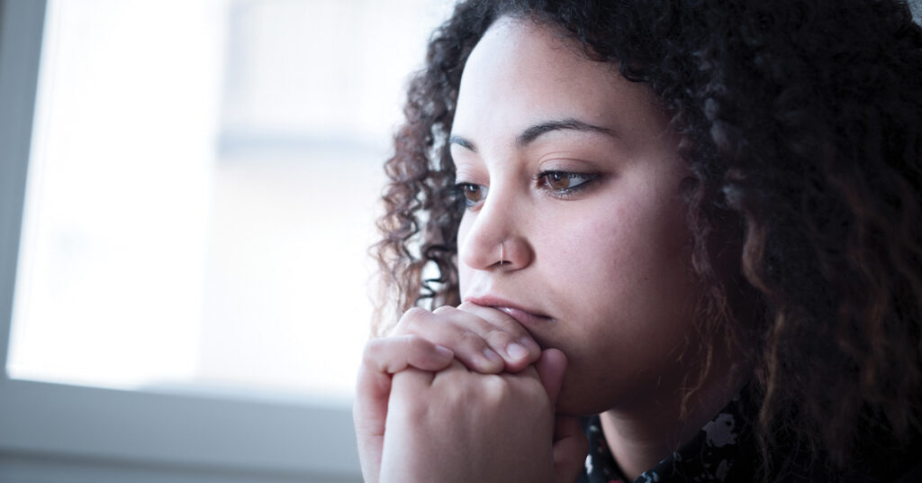 Sad and lonely young girl feeling depressed