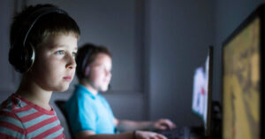 Two young children playing video games